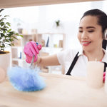 filipino-maid-cleaning-up-with-feather-duster_99043-3697